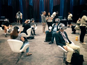 A group of people try VR headsets at NAB 2016 in Las Vegas